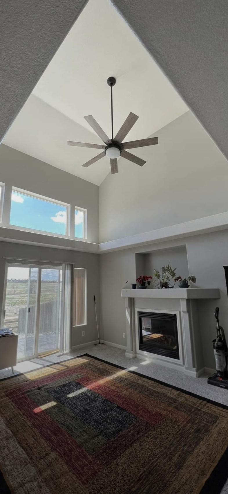 Ceiling fan installed on a 20-foot living room ceiling in Lafayette, CO by Bornschein Electric
